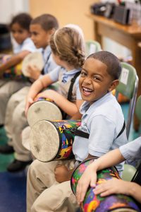 Boy playing music in school