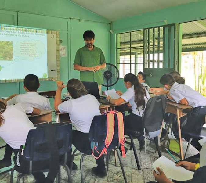 Ing Juan Pablo Aguero, TCA forestry engineer giving talk to students at Villa Nueva Elementary School