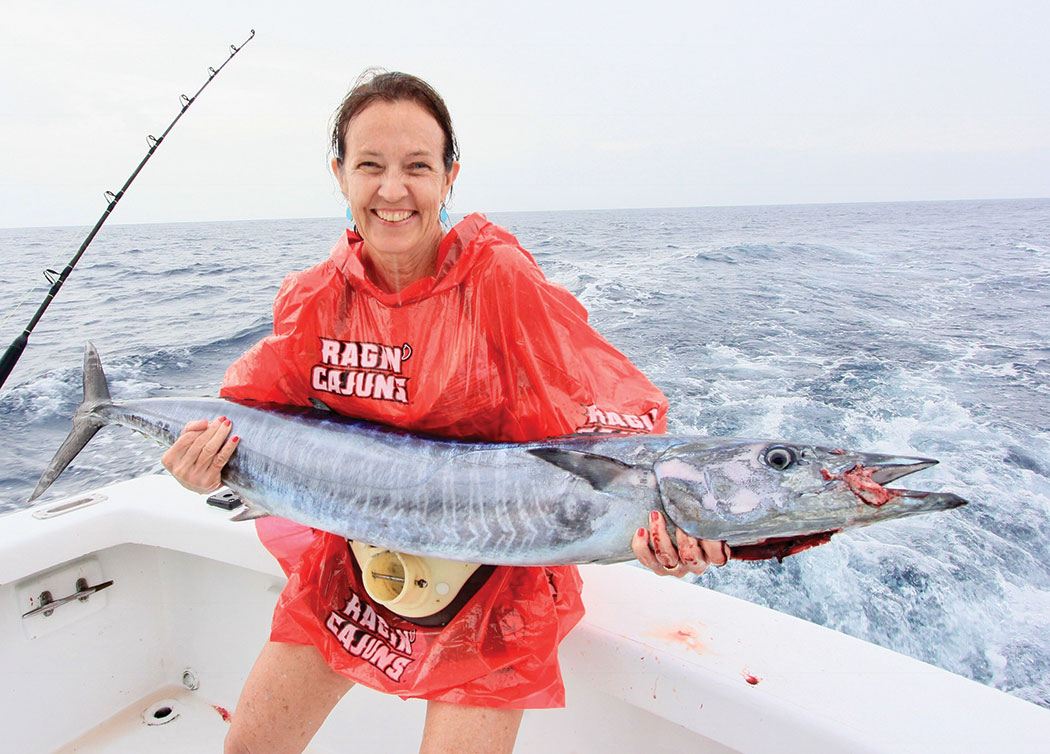Woman holding a mackerel