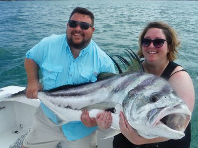 Couple with roosterfish
