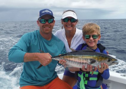 Family with yellow fin tuna