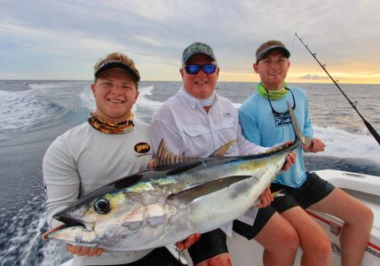 Three men with a tuna