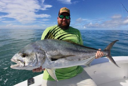 Man holding roosterfish