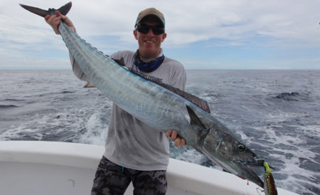 Man holding a large mackerel