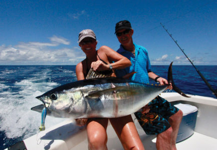 Woman holding large tuna