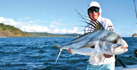 man holding a large roosterfish