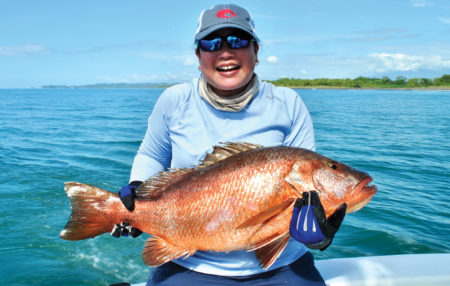 Woman holding a snapper