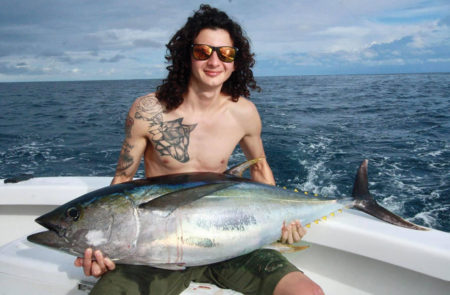 Man holding a tuna