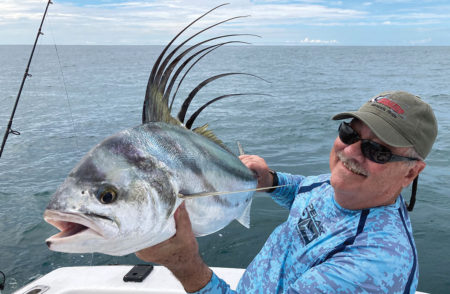 Man holding a roosterfish