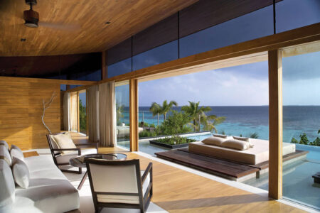 Living room overlooking pool and ocean